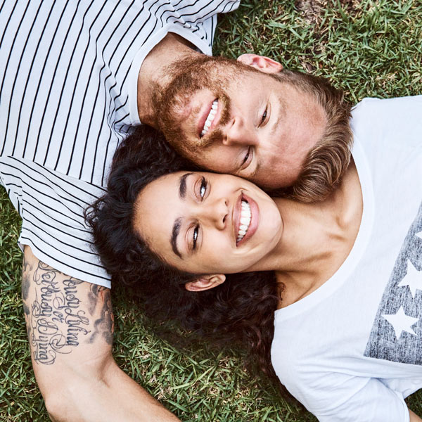 couple laying on grass