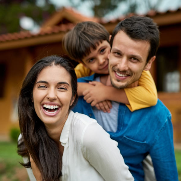 family of three laughing