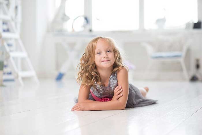 Small girl sitting on the floor