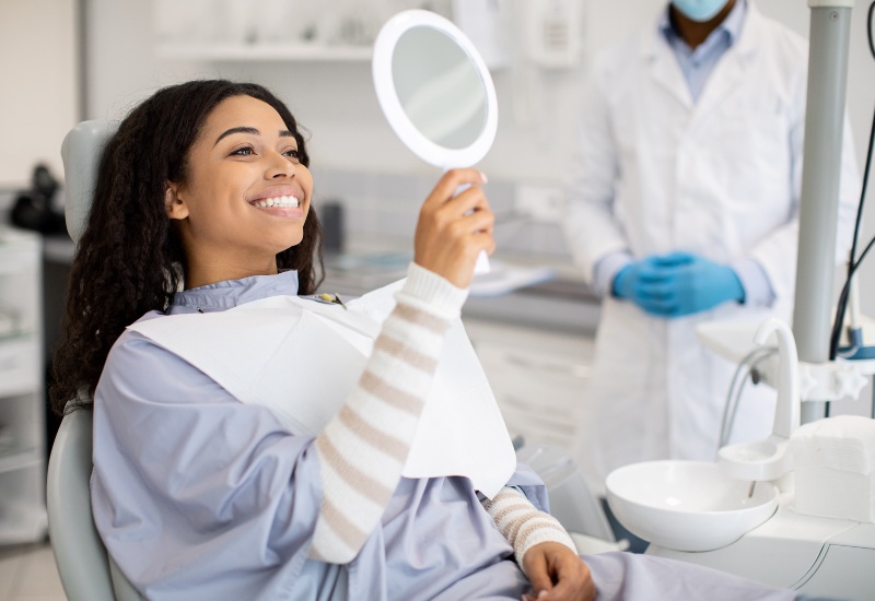 A girl smiling after the cosmetic dental treatment in Southfield, MI