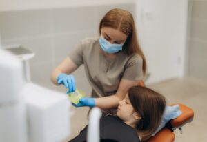 Fluoride treatment gel applied during pediatric dental visit in Southfield, MI